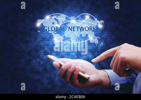 Global network concept, hand man holding mobile phone and virtual map and networking link. Stock Photo