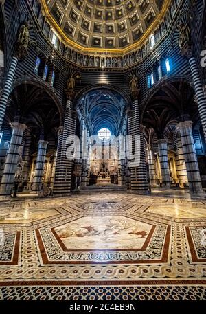 Wide angle view of the aisle and ceiling dome of Siena cathedral. Siena, Italy. Stock Photo