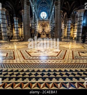 Wide angle view of the aisle and ceiling dome of Siena cathedral. Siena, Italy. Stock Photo