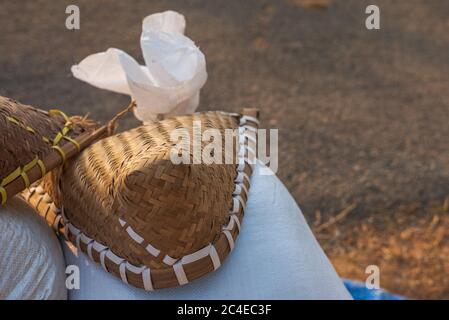 GOA, INDIA - May 12, 2020: Large dustpan-shaped kitchen appliance made of bamboo - a winnowing fan used for harvesting of paddy in Goa, India Stock Photo