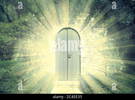 Door of the heaven in a dreamy rosegarden  with sunbeam Stock Photo