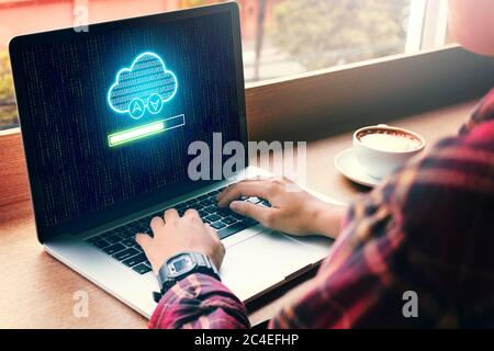Hipster man hand using laptop with cloud computing and uploading files on cloud network server. Stock Photo