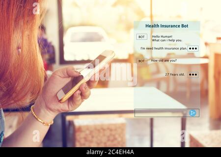 Woman chatting with automatic bot on smartphone and talking about consulting health insurance. Stock Photo