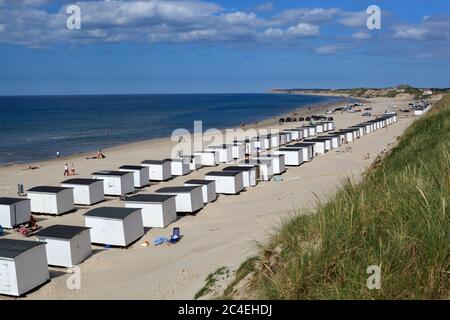 White sand beach and huts on North Sea coast, Lokken, Jutland, Denmark, Europe Stock Photo