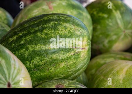 Whole watermelons for sale on a market stall Stock Photo