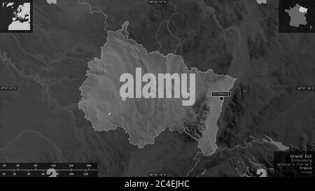 Grand Est, region of France. Grayscaled map with lakes and rivers. Shape presented against its country area with informative overlays. 3D rendering Stock Photo