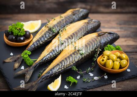 Smoked mackerel fish on the wooden table Stock Photo