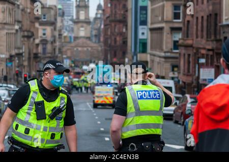 Glasgow, Scotland, UK. 26th June, 2020. Armed officers were called to a major police incident in the city centre as reports of six people injured by knife attack including a police officer at the Park Inn Hotel on West George Street. The attacker was shot dead by police. The hotel is used to accommodate asylum seekers during the coronavirus pandemic. Credit: Skully/Alamy Live News Stock Photo