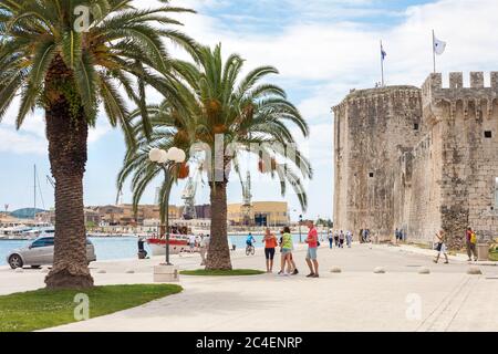 TROGIR, CROATIA - JUNE 19, 2014: The Old Town of Trogir with tourists in front of the fortress in Croatia. UNESCO World heritage place Stock Photo