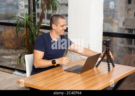 Man video blogger filming himself at home Stock Photo