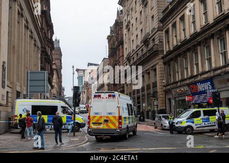 Glasgow, Scotland, UK. 26th June, 2020. Armed officers were called to a major police incident in the city centre as reports of six people injured by knife attack including a police officer at the Park Inn Hotel on West George Street. The attacker was shot dead by police. The hotel is used to accommodate asylum seekers during the coronavirus pandemic. Credit: Skully/Alamy Live News Stock Photo