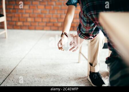 Two school hand passing notes to each other secretly during class. Stock Photo