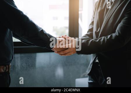 Business people holding hands together for support empathy work together. Stock Photo