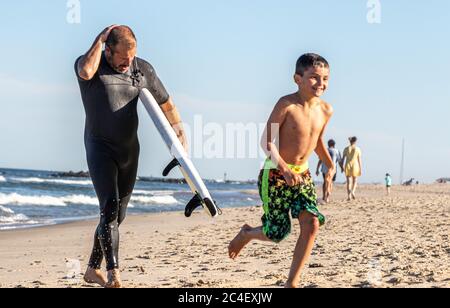 Father and son surfing lessons Stock Photo