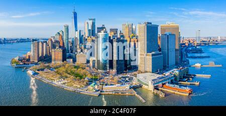 Aerial view of the Lower Manhattan skyline featuring One World Trade Center, Battery Park, Staten Island Ferry, and South Street Seaport. Stock Photo