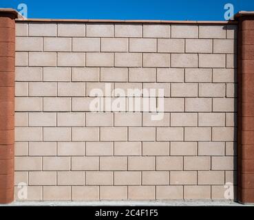 White grey brick wall concrete texture with orange columns. Grunge, cement. Seamless texture of a brick wall Stock Photo