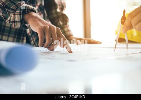 Co-worker or architect startup working together on blueprint with partnership. Stock Photo