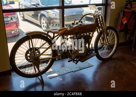 An antique Harley Davidson board track racing bike sits in the showroom of Brandt's I-69 Harley Davidson motorcycle dealership in Marion, Indiana, USA. Stock Photo