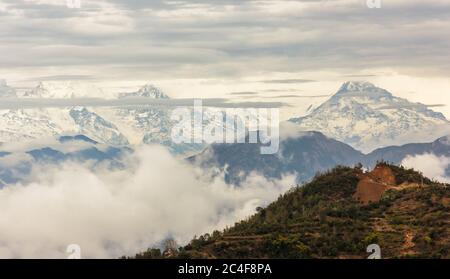 A view of the mountains of the snowcapped Annapurna range in the HImalayan town of Tansen in Nepal. Stock Photo