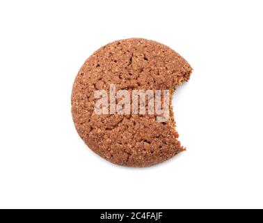 Single round ginger biscuit with crumbs and bite missing, isolated on white Stock Photo