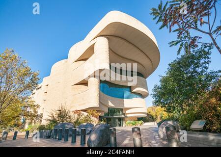 Washington DC USA - October 27 2014; Low point of view image of Douglas Cardinal designed National Musuem of the American Indian and stunning architec Stock Photo