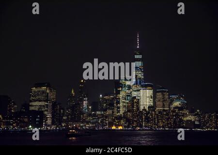 Winter cruise . New York City skyline by night. View from Hudson river, New York, USA, America. Stock Photo