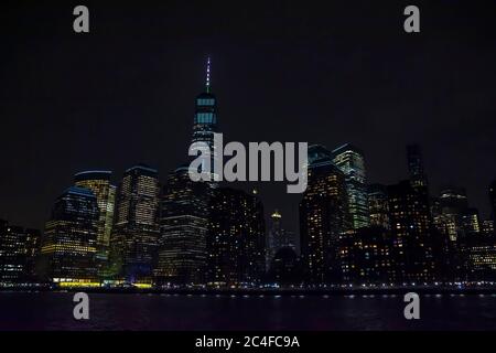 Winter cruise . New York City skyline by night. View from Hudson river, New York, USA, America. Stock Photo