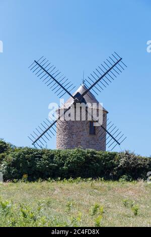 Traditional windmill made in stones in Plogoff Stock Photo