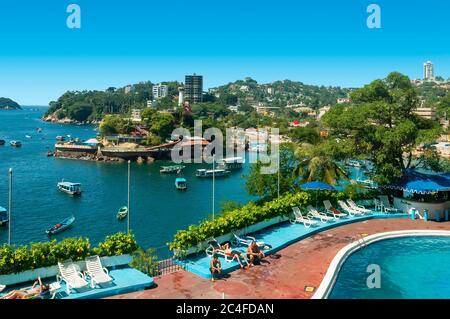 Acapulco, Mexico - October 31, 2005: The beaches of Caleta and Caletilla, the main part of the bay known as 'Zona Dorada' ('golden zone' in Spanish), Stock Photo