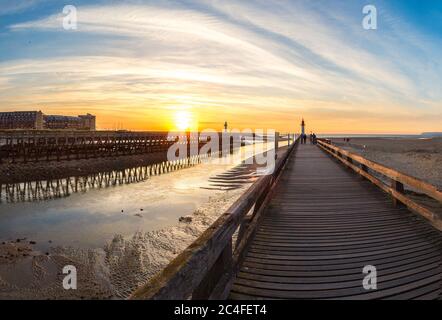 Panorama of Wooden Pier and Lighthouse in Trouville and Deauville in a beautiful summer evening, France Stock Photo