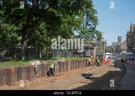 Wall of South Leith Parish churchyard removed and archaeologists working on the medieval graveyard in Constitution Street, Leith, Edinburgh, Scotland. Stock Photo