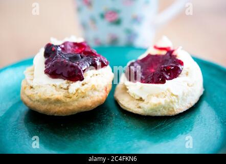 Cream tea on a turquoise plate Stock Photo