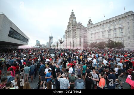 Liverpool fans let off flares outside the Liver Building in Liverpool. Stock Photo