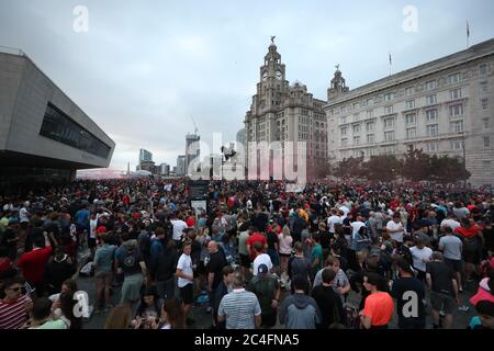 Liverpool fans let off flares outside the Liver Building in Liverpool. Stock Photo