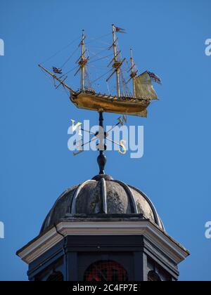 ROCHESTER, KENT, UK - SEPTEMBER 13, 2019:  The weather vane in the form of a fully rigged 18th-century warship above Rochester Guildhall Museum Stock Photo
