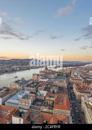 Aerial drone shot of Hungarian Parliament Kossuth Square by Danube river in Budapest sunset Stock Photo