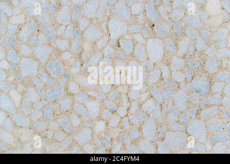 Decorative polished beige concrete tile on the facade of the building as a background or backdrop. brick wall texture background. Brickwork or Stock Photo
