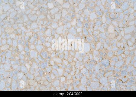 Decorative polished beige concrete tile on the facade of the building as a background or backdrop. brick wall texture background. Brickwork or Stock Photo