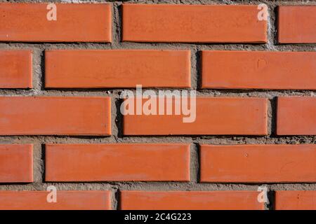A close up of a brick building. background section of brick wall dark red macro Stock Photo