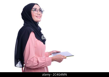 Confidence of interactive pretty muslim woman with tablet. Business or Finance interactive conceptual Stock Photo