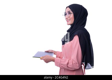 Confidence of interactive pretty muslim woman with tablet. Business or Finance interactive conceptual Stock Photo