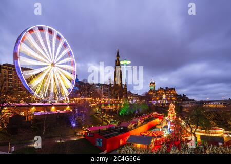 Rotating giant Ferris Wheel in Princes Street, Gardens on New Years Day, Edinburgh, Scotland, United Kingdom. Stock Photo