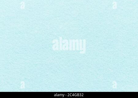 High resolution close up of light blue felt fabric texture of rough fleecy fabric of blue color for backgrounds and for wallpaper an light blue piece Stock Photo