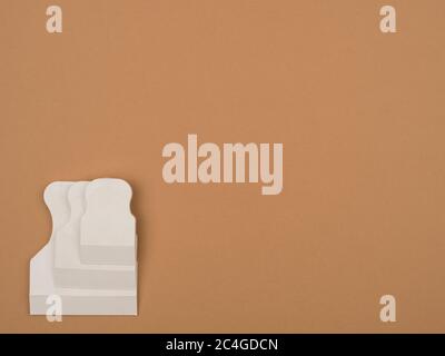 Rubber spatula on a beige background. Spatula for grouting. Stock Photo