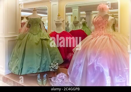 San Luis Potosi, Mexico - October 20, 2006: A store window display with dresses worn by young women in traditional coming of age celebrations. Stock Photo