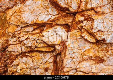 Abstract background from toned mountains texture, volcanic rock. Bright colorful rock texture background for your design. Close-up Stock Photo