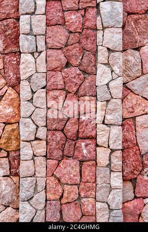 pink marble stone wall texture background. Closeup surface grunge stone texture, stonework rock pattern uneven bricks design stack. Stock Photo