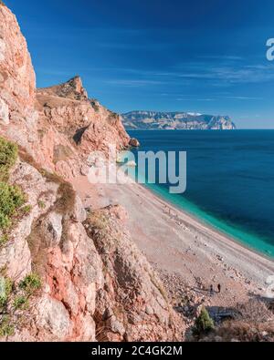 Beautiful Vasili beach in Balaklava, Sevastopol, Crimea. View from the top of the rock. azure sea, sunny day clear sky background. Copy space. The Stock Photo