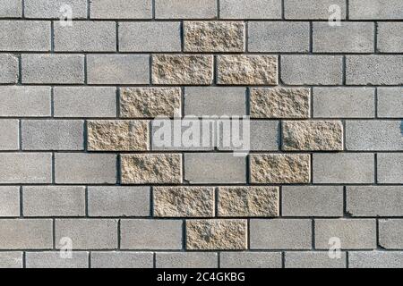 White grey brick wall concrete texture. Grunge, cement. Seamless texture of a brick wall with yellow rhombus pattern Stock Photo
