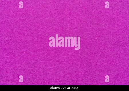 High resolution close up of bright pink felt fabric texture of rough fleecy fabric of pink color for backgrounds and for wallpaper an intense pink Stock Photo